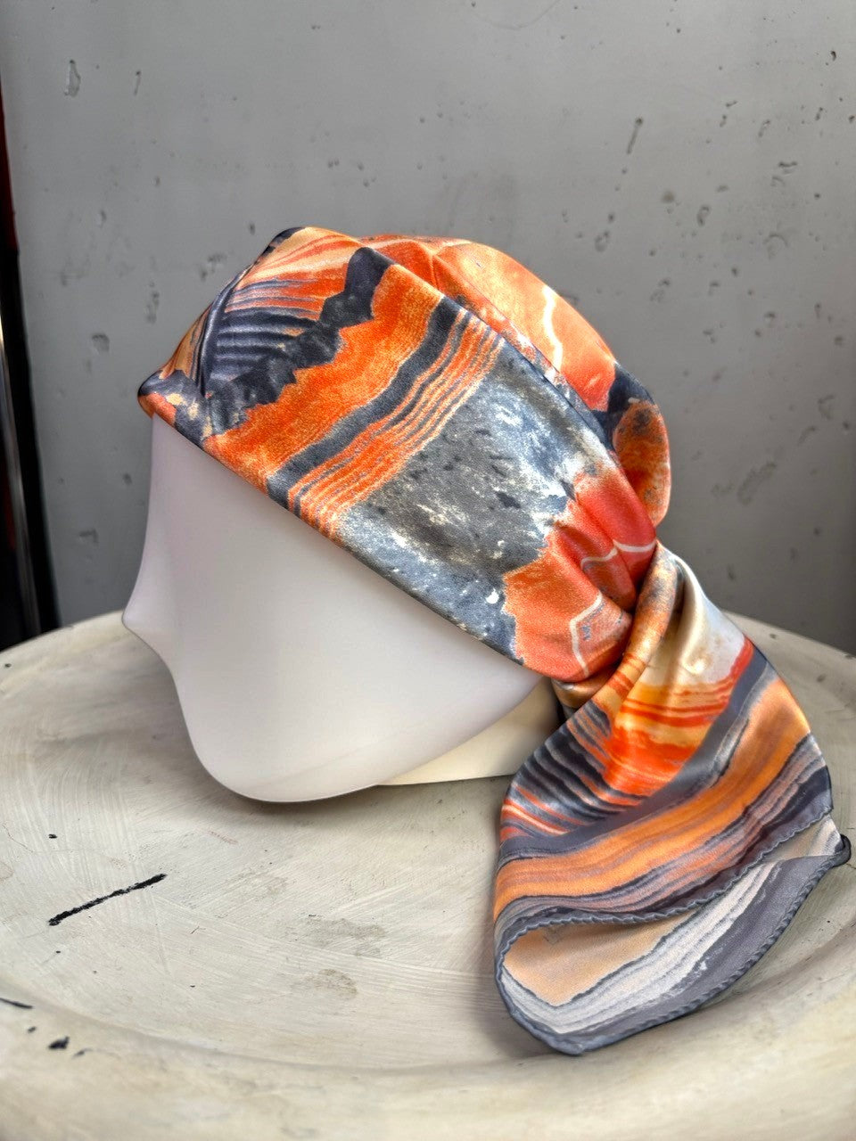 BERLIN VINTAGE CORNER silk scarf with burnt orange, charcoal, and cream geode-inspired abstract print on mannequin