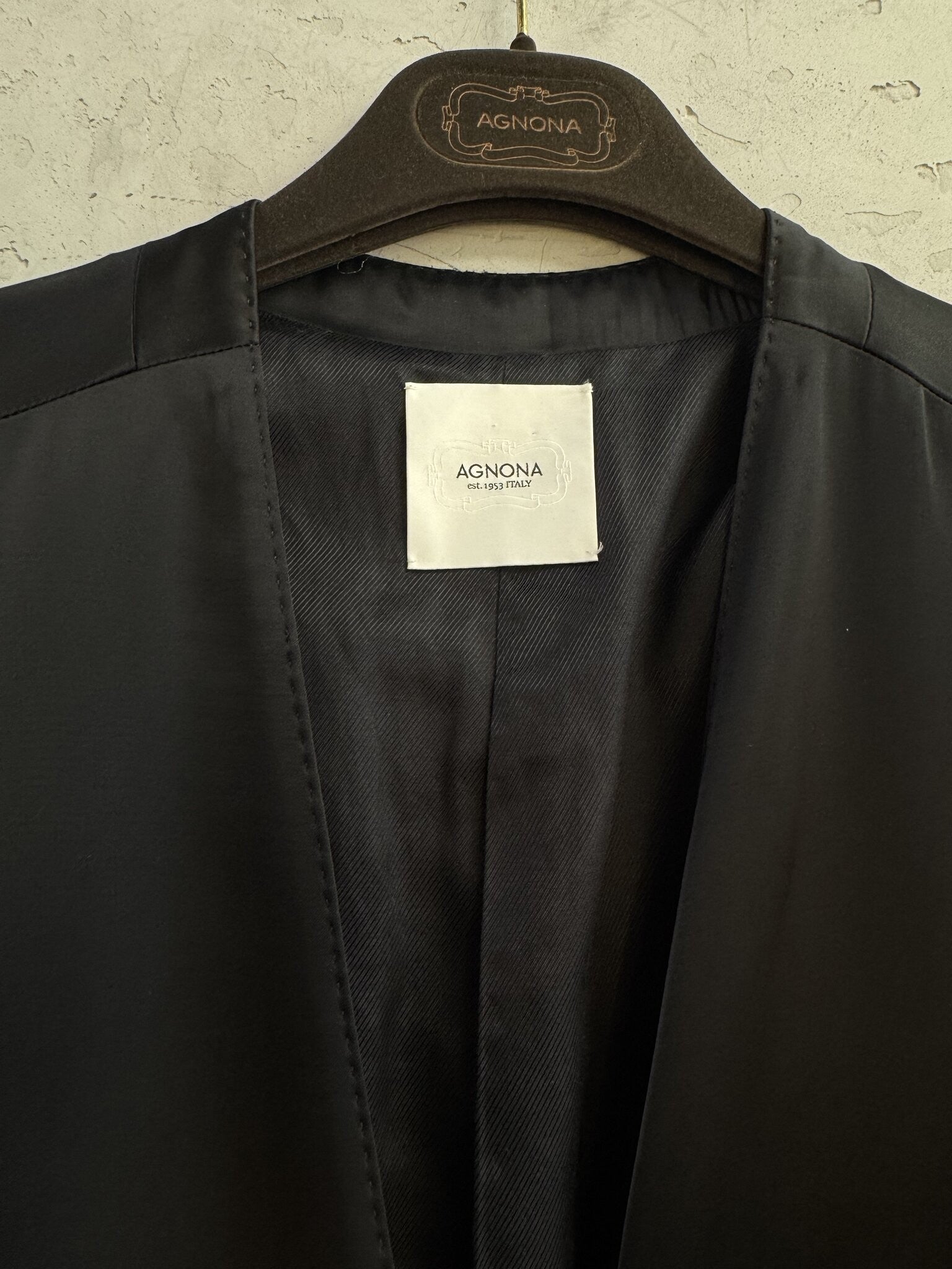 BERLIN VINTAGE CORNER Agnona black collarless longline coat featuring a premium fabric label and luxury hanger