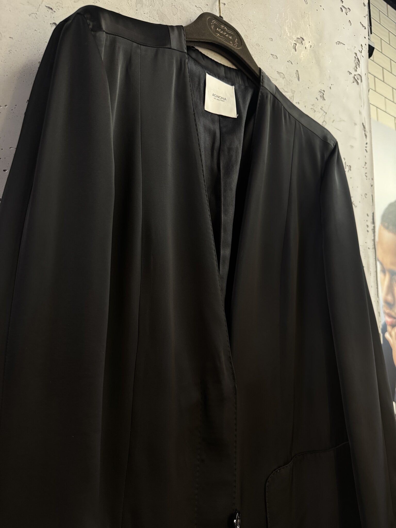 BERLIN VINTAGE CORNER Agnona black lightweight longline coat with a collarless neckline and subtle satin sheen.