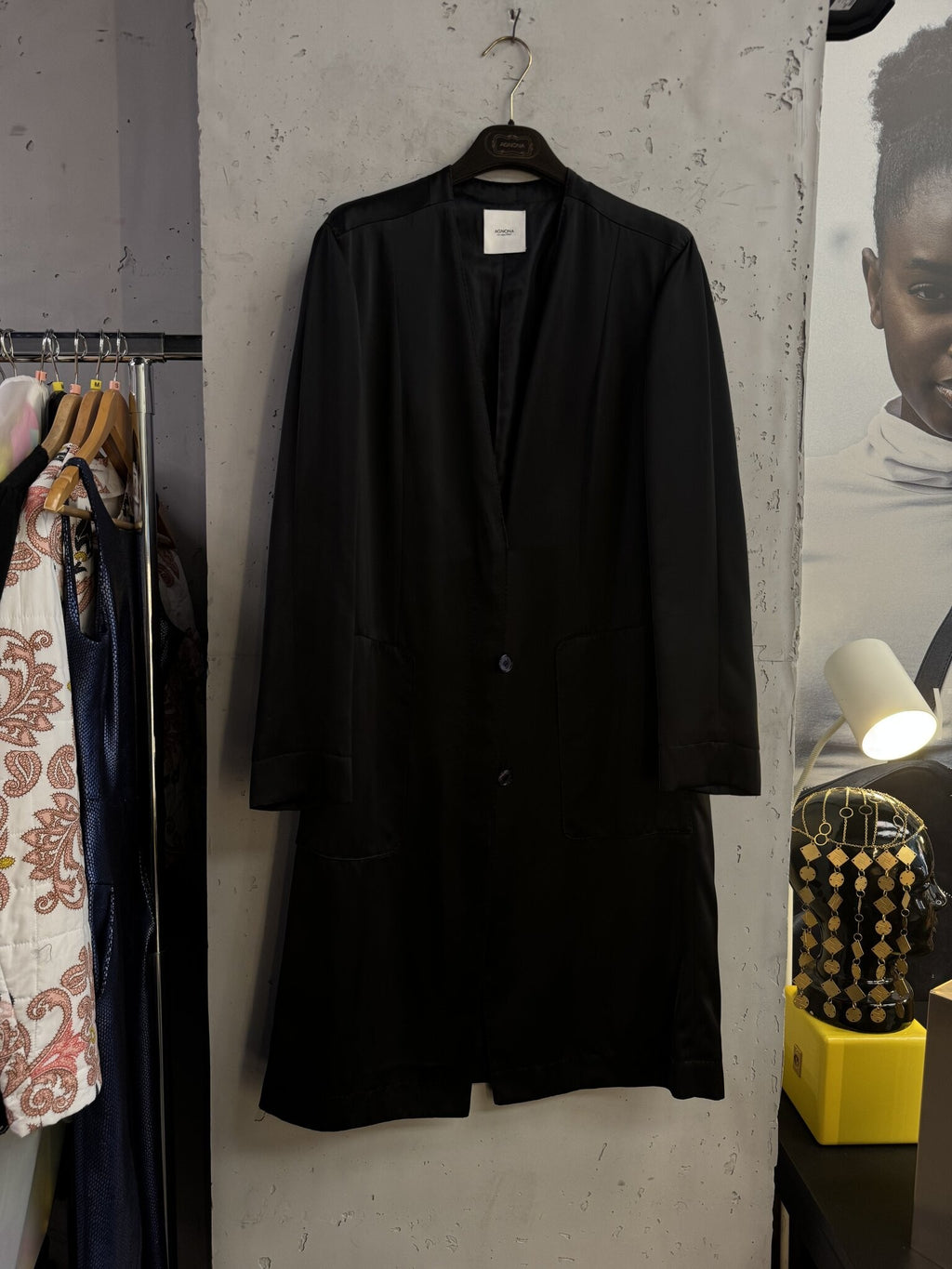 BERLIN VINTAGE CORNER Agnona black longline collarless coat with front patch pockets and button closure.