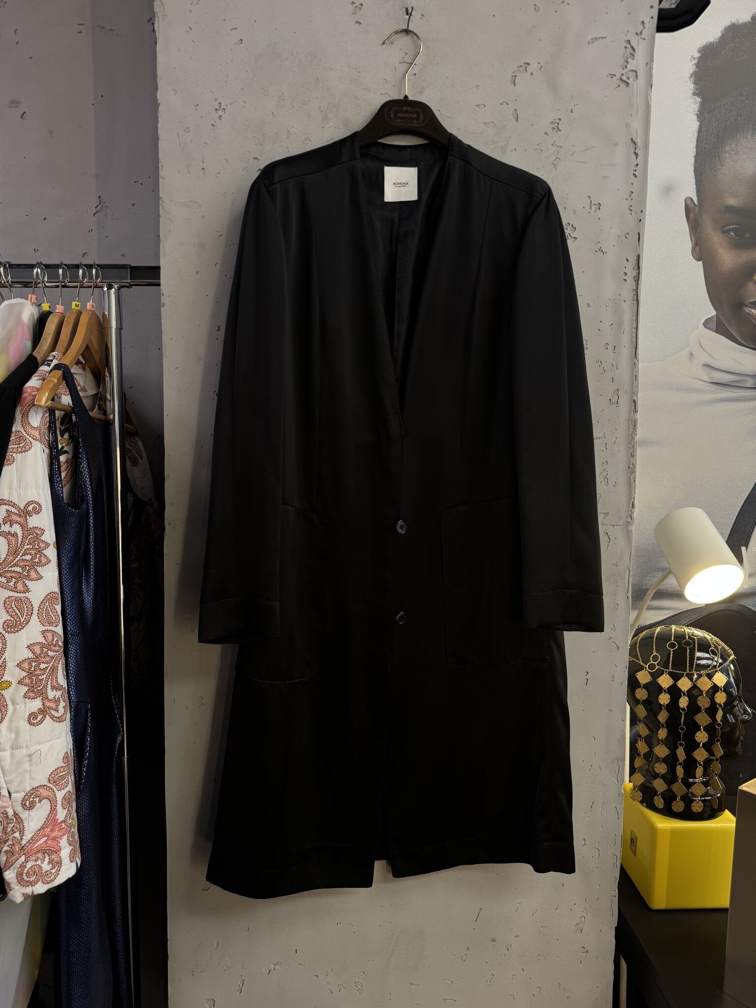BERLIN VINTAGE CORNER Agnona black longline collarless coat with front patch pockets and button closure.