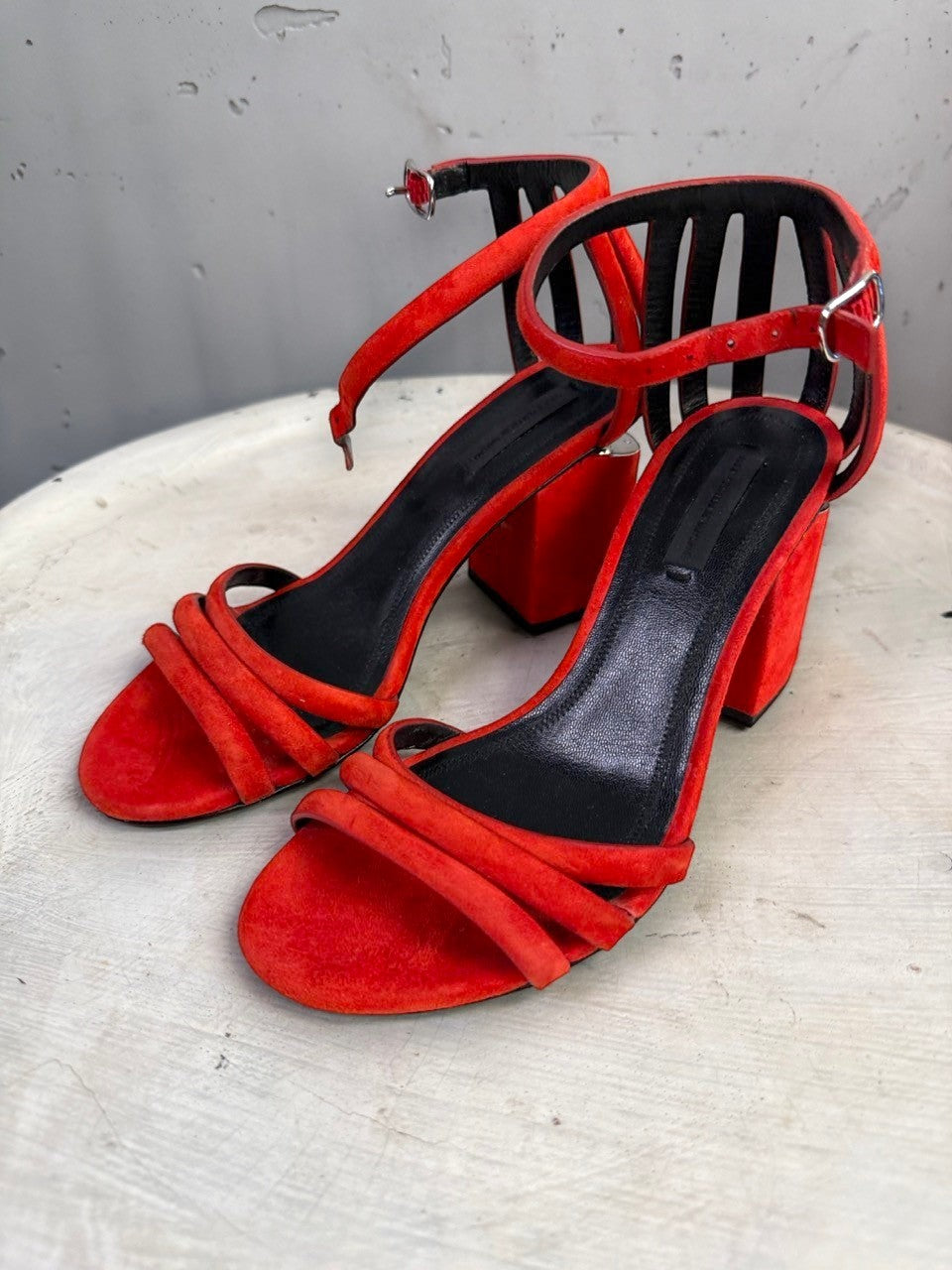 BERLIN VINTAGE CORNER Alexander Wang red suede block heel sandals with cage-style ankle straps and metallic heel detail.