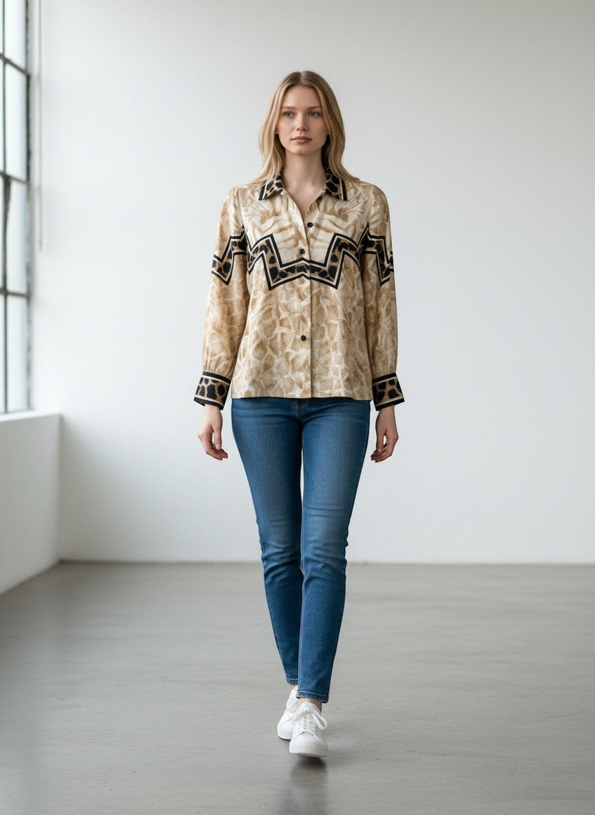 BERLIN VINTAGE CORNER long-sleeved blouse with abstract animal print, black and tan trim, and zig-zag pattern. Lightweight fabric.