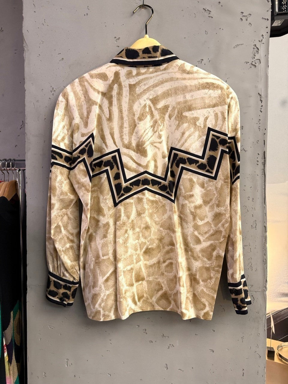 BERLIN VINTAGE CORNER long-sleeved button-up shirt with mixed animal prints in tan and black, featuring zebra and giraffe patterns.