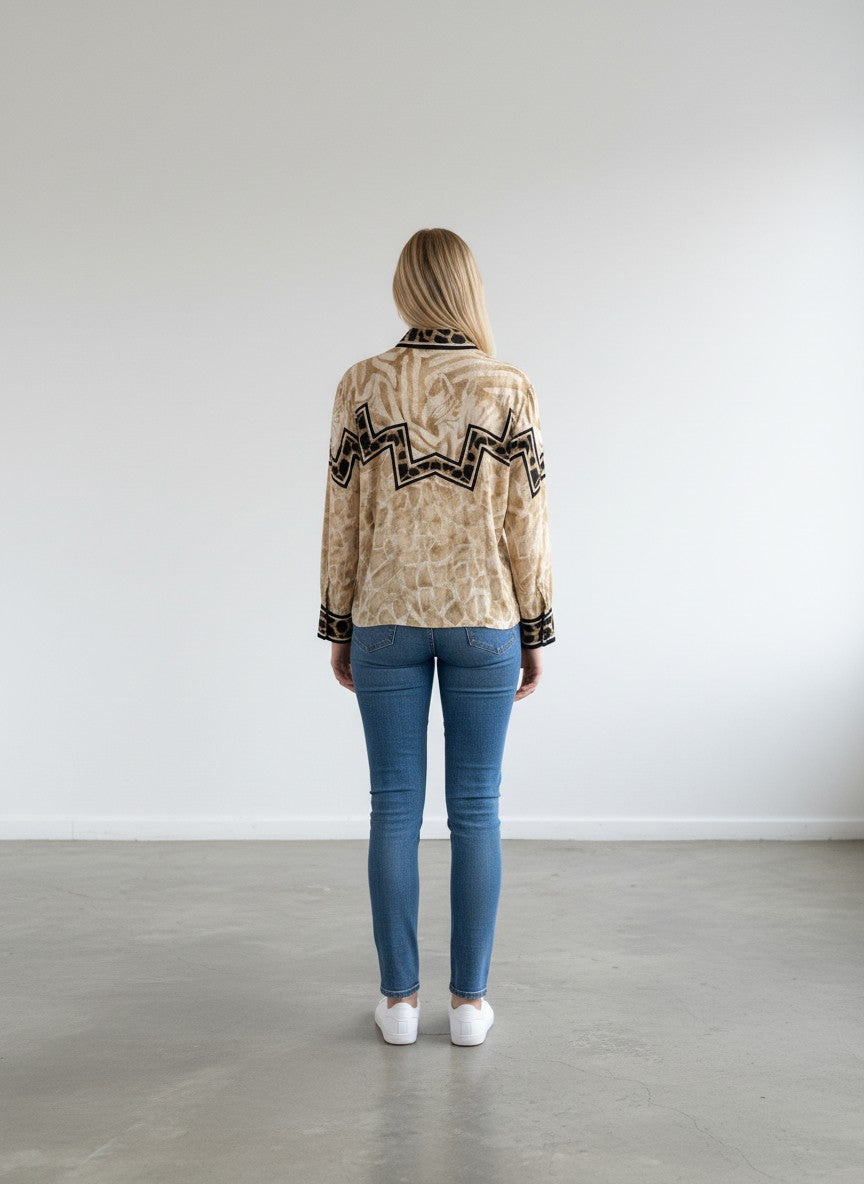 BERLIN VINTAGE CORNER long-sleeved button-up shirt with mixed animal prints in tan and black, featuring zebra and giraffe patterns.