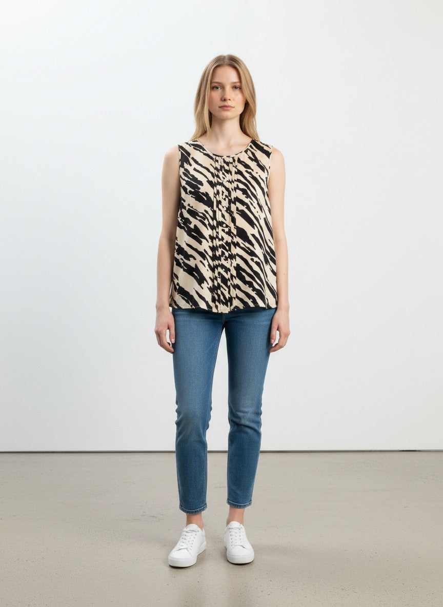 BERLIN VINTAGE CORNER sleeveless beige and black animal print silk blend blouse with pintuck detailing and button closure.