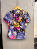 BERLIN VINTAGE CORNER Balenciaga short sleeve blouse featuring a vibrant fuchsia, violet, and olive floral print.