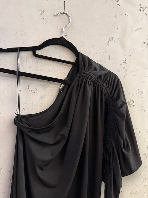 BERLIN VINTAGE CORNER Balmain black one-shoulder midi dress with ruched sleeve detail on a hanger.