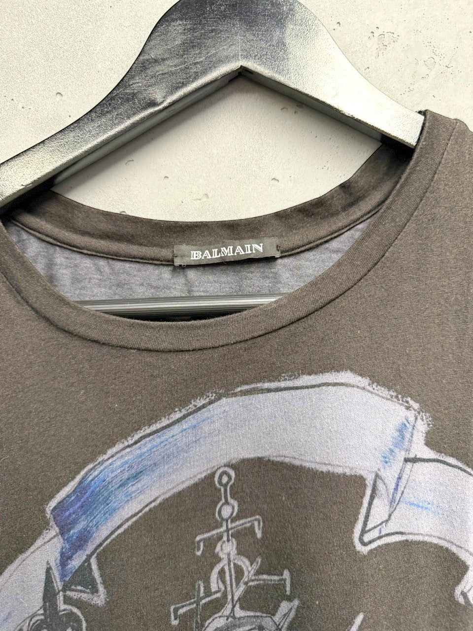 BERLIN VINTAGE CORNER dark grey cotton Balmain graphic print sleeveless top with vintage crest and banner design.