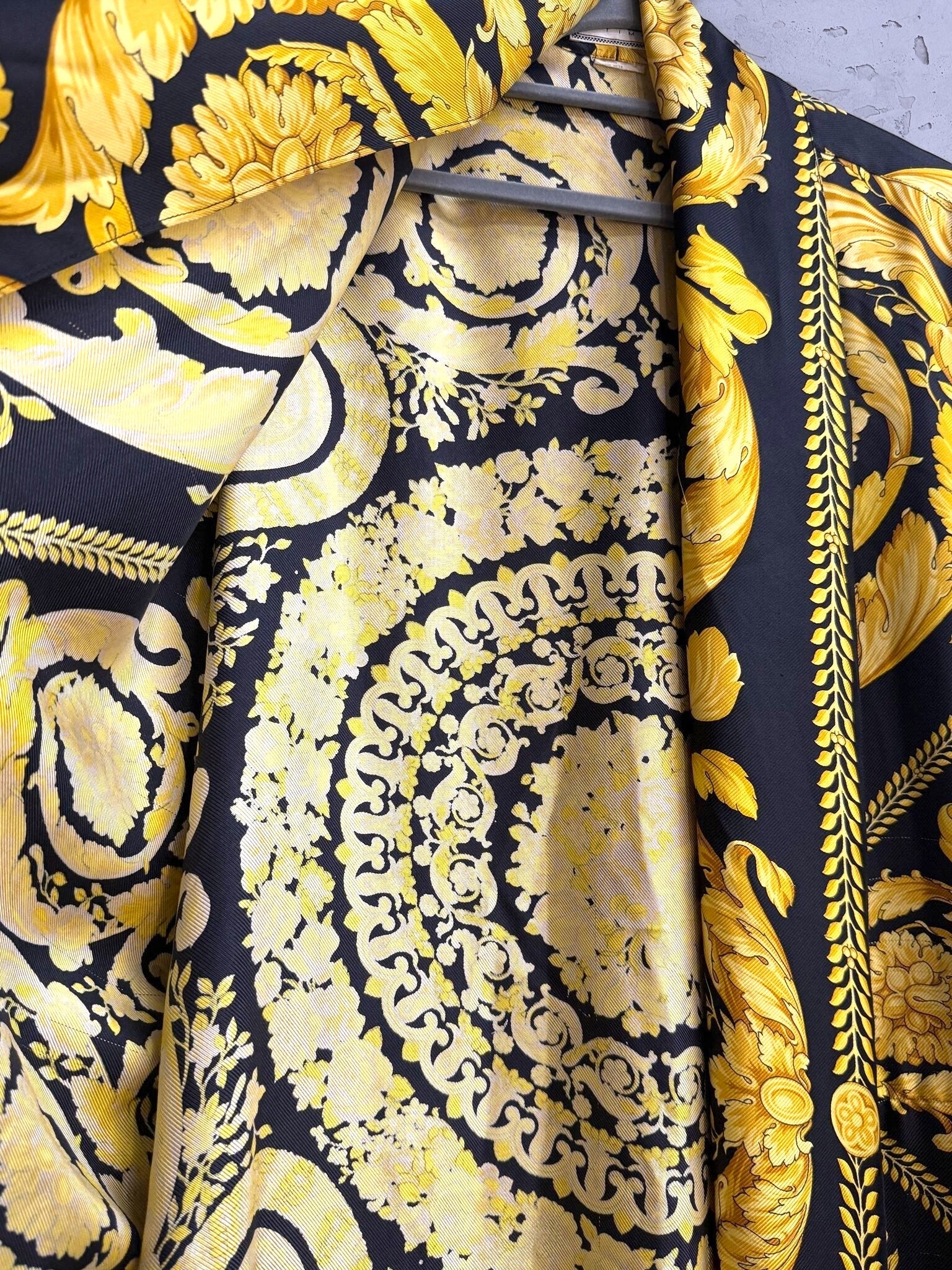 BERLIN VINTAGE CORNER long kimono robe featuring a bold black and gold ornate baroque print with intricate patterns.