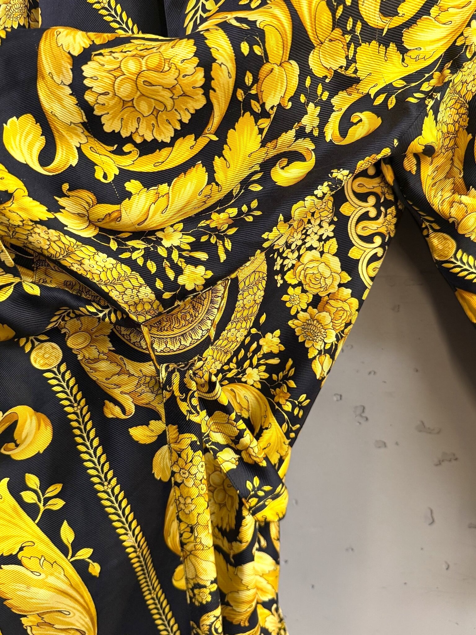 BERLIN VINTAGE CORNER long kimono robe featuring a bold black and gold ornate baroque print with intricate details.