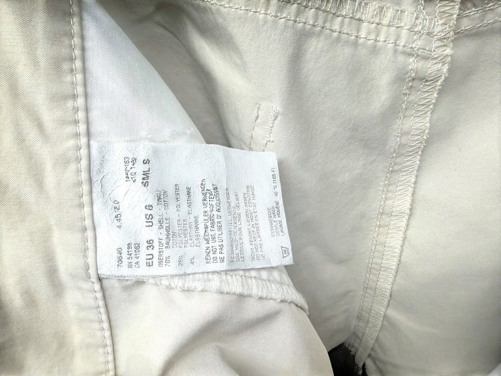 BERLIN VINTAGE CORNER beige cotton blend cropped trousers with five-pocket design and split hem.