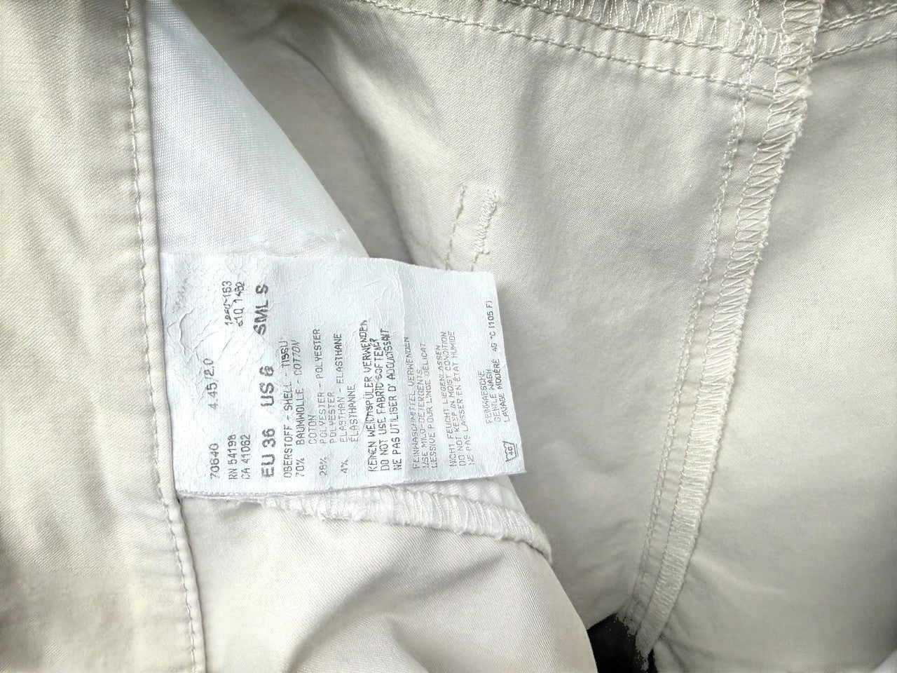 BERLIN VINTAGE CORNER beige cotton blend cropped trousers with five-pocket design and split hem.