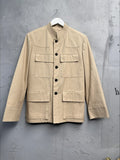 BERLIN VINTAGE CORNER beige cotton blend safari jacket with YSL logo, textured collar, button-down front, and multiple pockets.