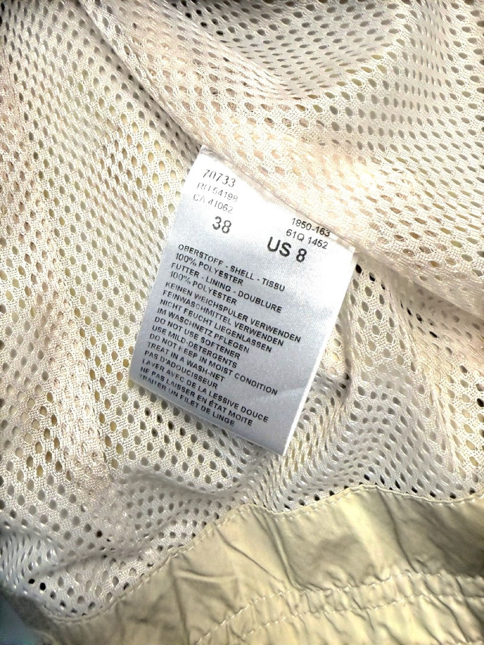 BERLIN VINTAGE CORNER beige polyester utility jacket with multiple pockets and mesh lining.
