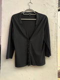 BERLIN VINTAGE CORNER black fine knit cardigan with braided neckline detail and three-quarter sleeves.
