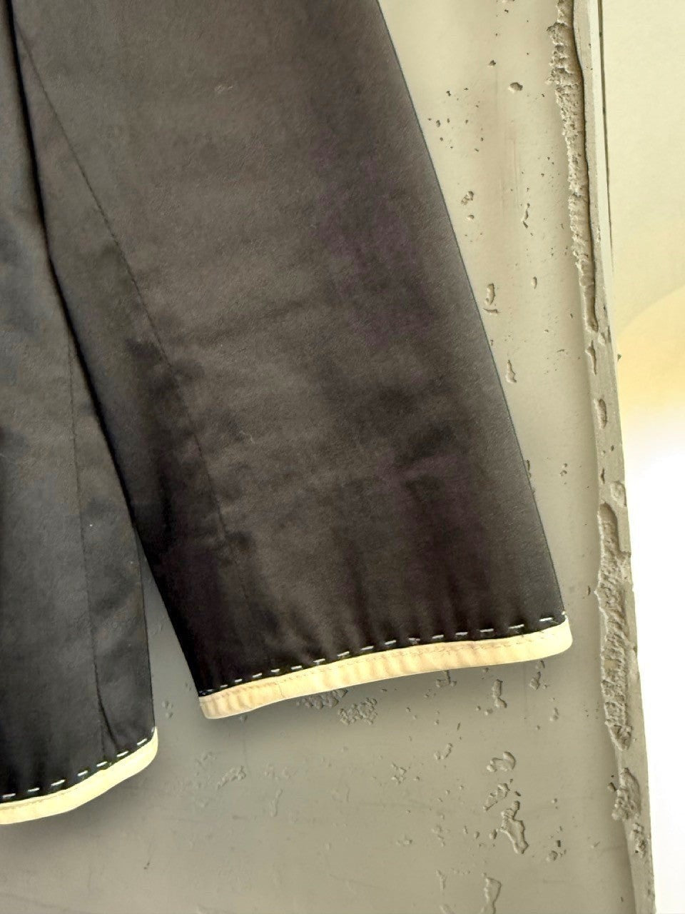 BERLIN VINTAGE CORNER black cropped blazer jacket with white piping and stitching detail on hem and sleeves.