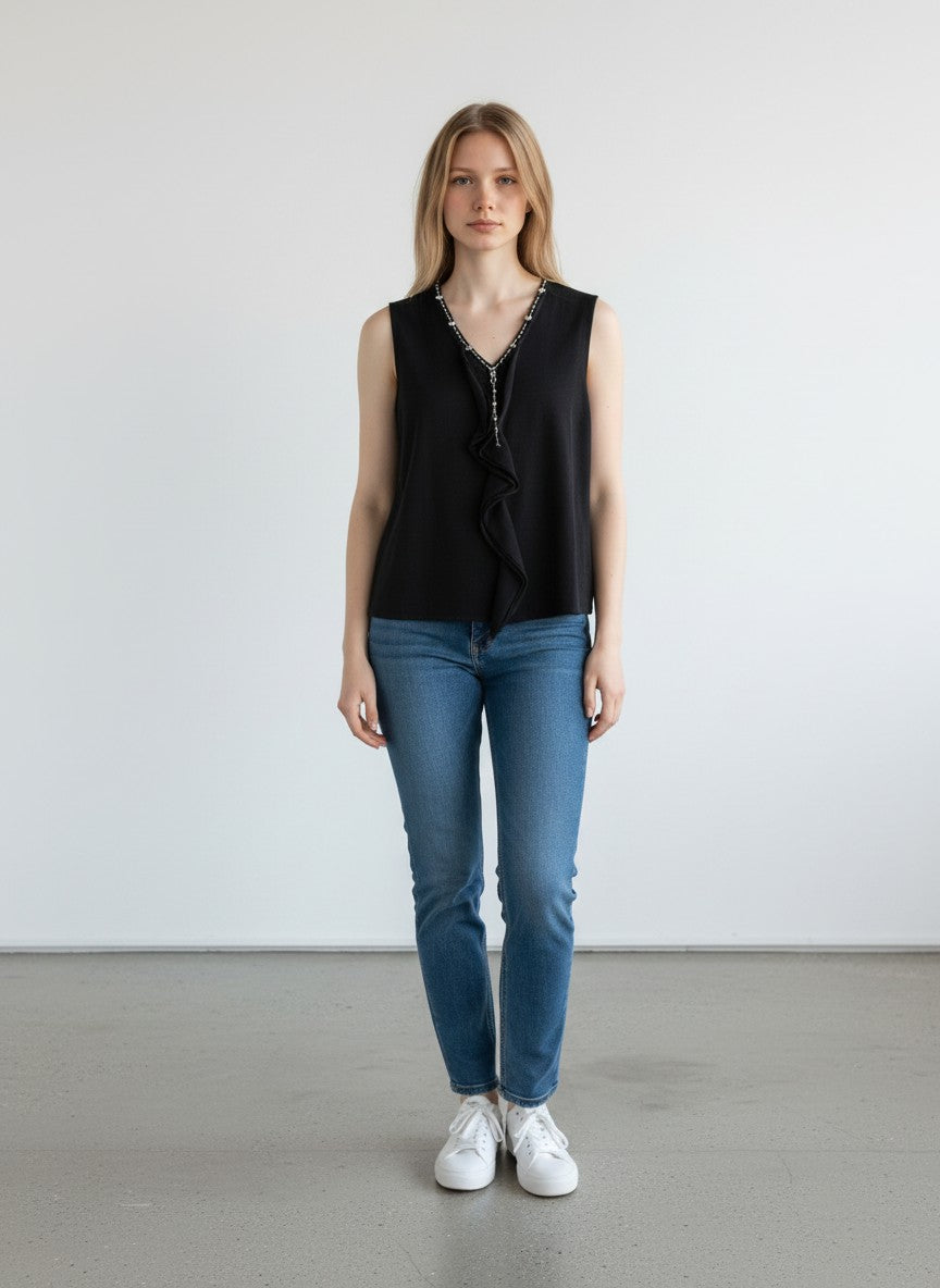 BERLIN VINTAGE CORNER black sleeveless knit V-neck top with crystal and bead embellishments and ruffled front detail.