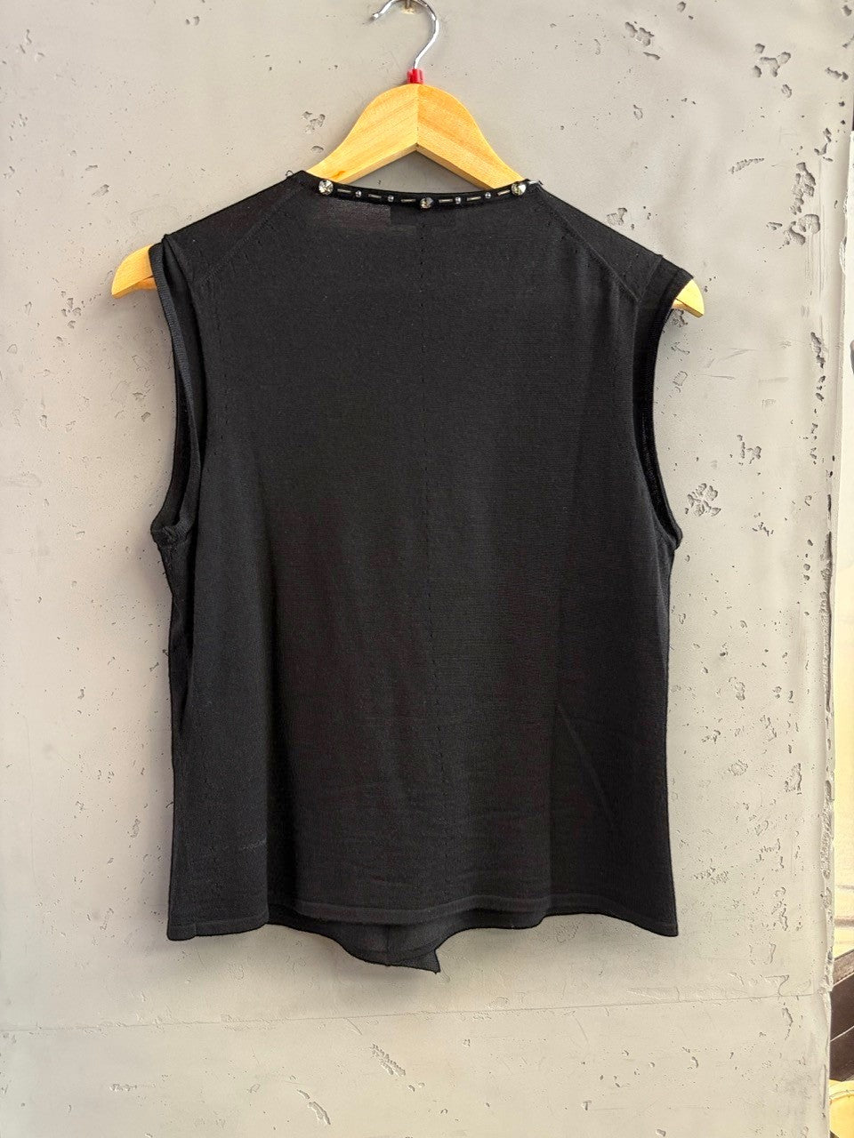 BERLIN VINTAGE CORNER black sleeveless knit top with embellished V-neckline and crystal trim.