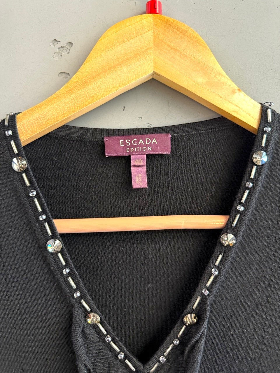 BERLIN VINTAGE CORNER black knit V-neck sleeveless top with crystal and bead embellishments.