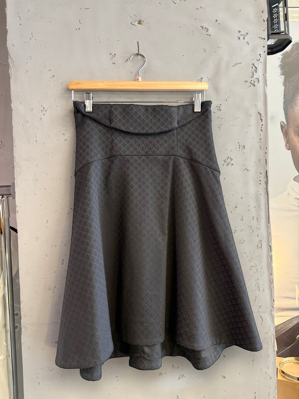 BERLIN VINTAGE CORNER black A-line skirt with geometric jacquard pattern, concealed zipper, and flared hem.