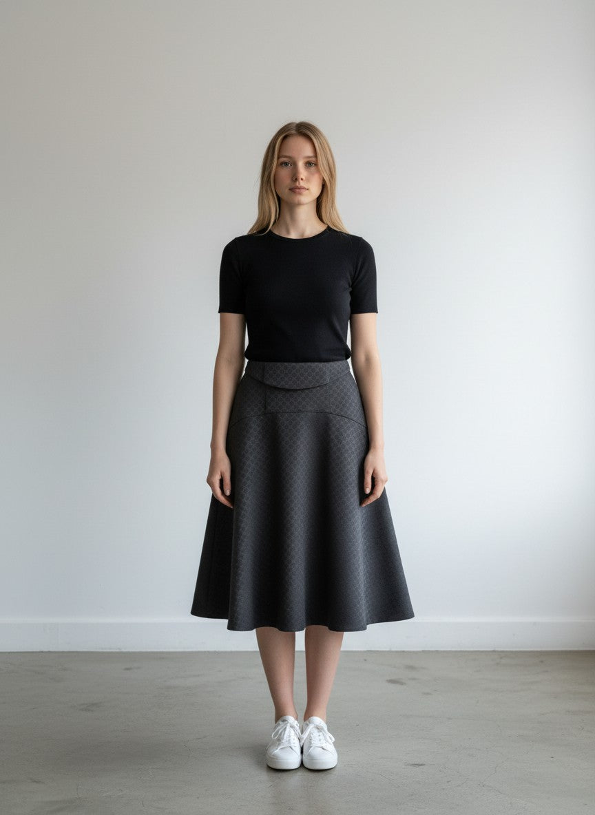 BERLIN VINTAGE CORNER black A-line jacquard pattern skirt with concealed zipper and textured fabric.