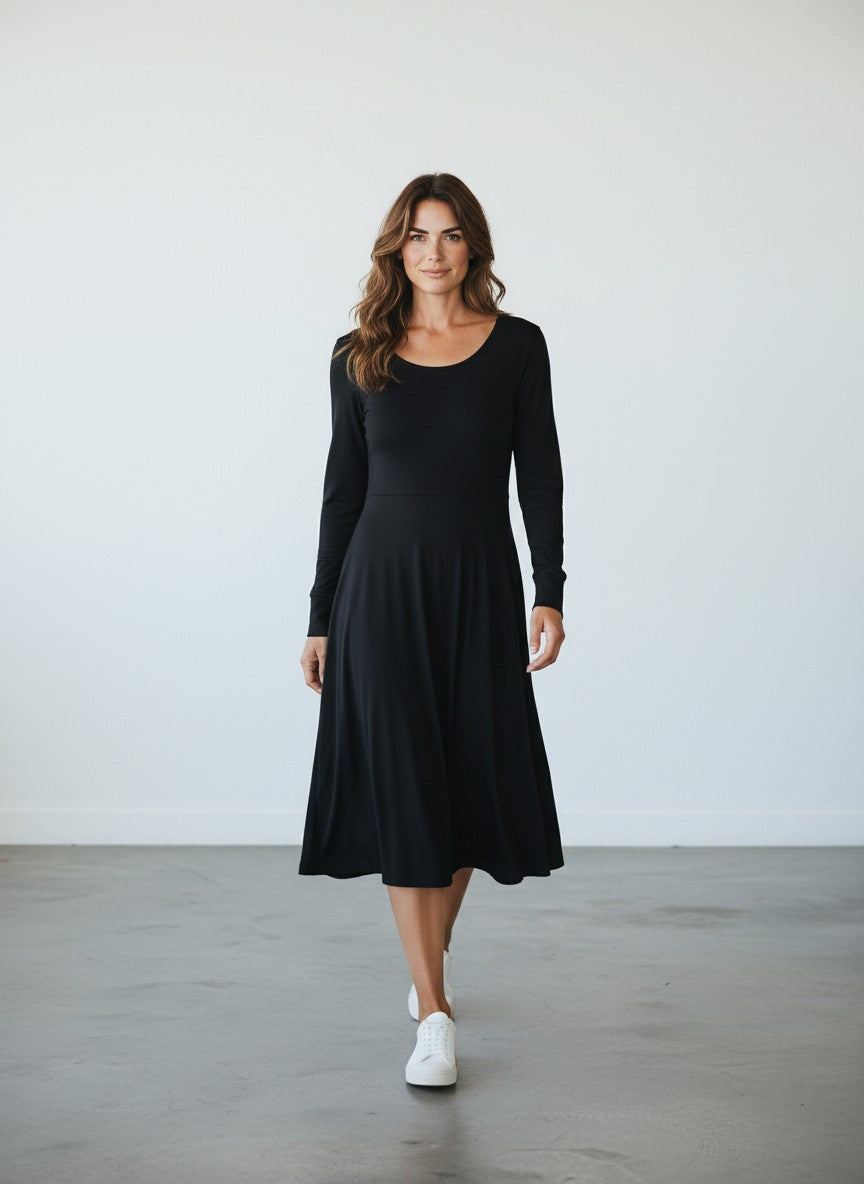 BERLIN VINTAGE CORNER black long sleeve knit midi dress with scoop neckline and defined waistline.