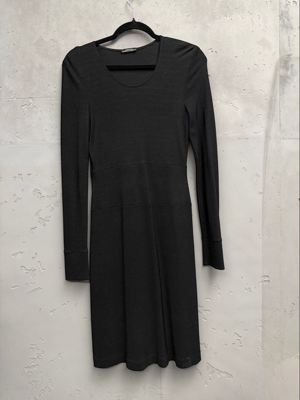 BERLIN VINTAGE CORNER black long sleeve knit midi dress with scoop neckline and defined waistline.