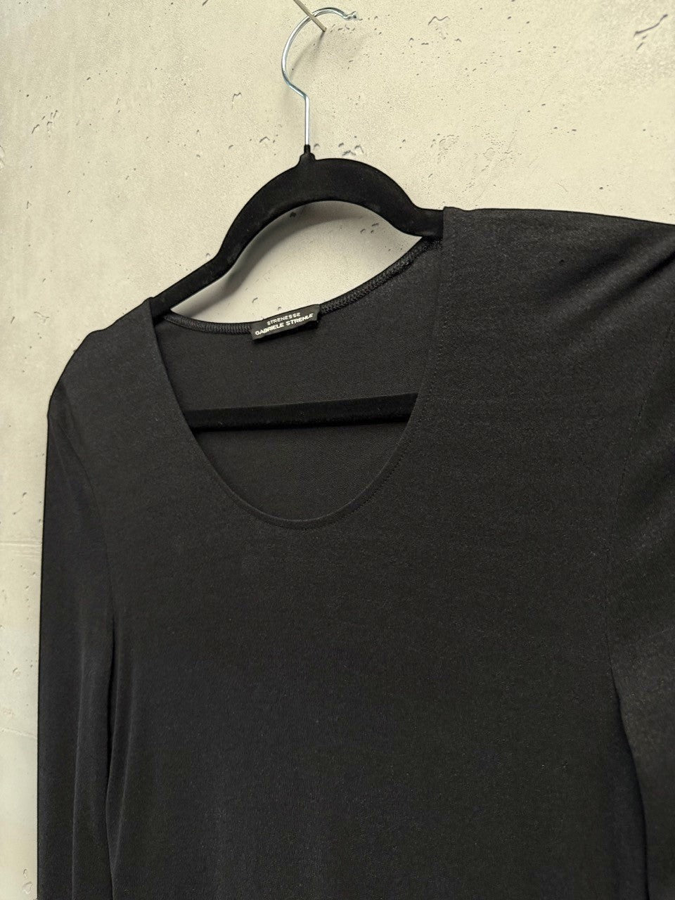 BERLIN VINTAGE CORNER black long sleeve knit midi dress with scoop neckline and defined waistline.