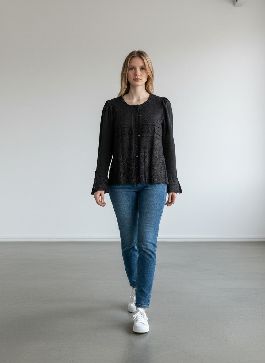 BERLIN VINTAGE CORNER black long sleeve knit top with lace trim and flared cuffs. Delicate dot pattern on bodice.