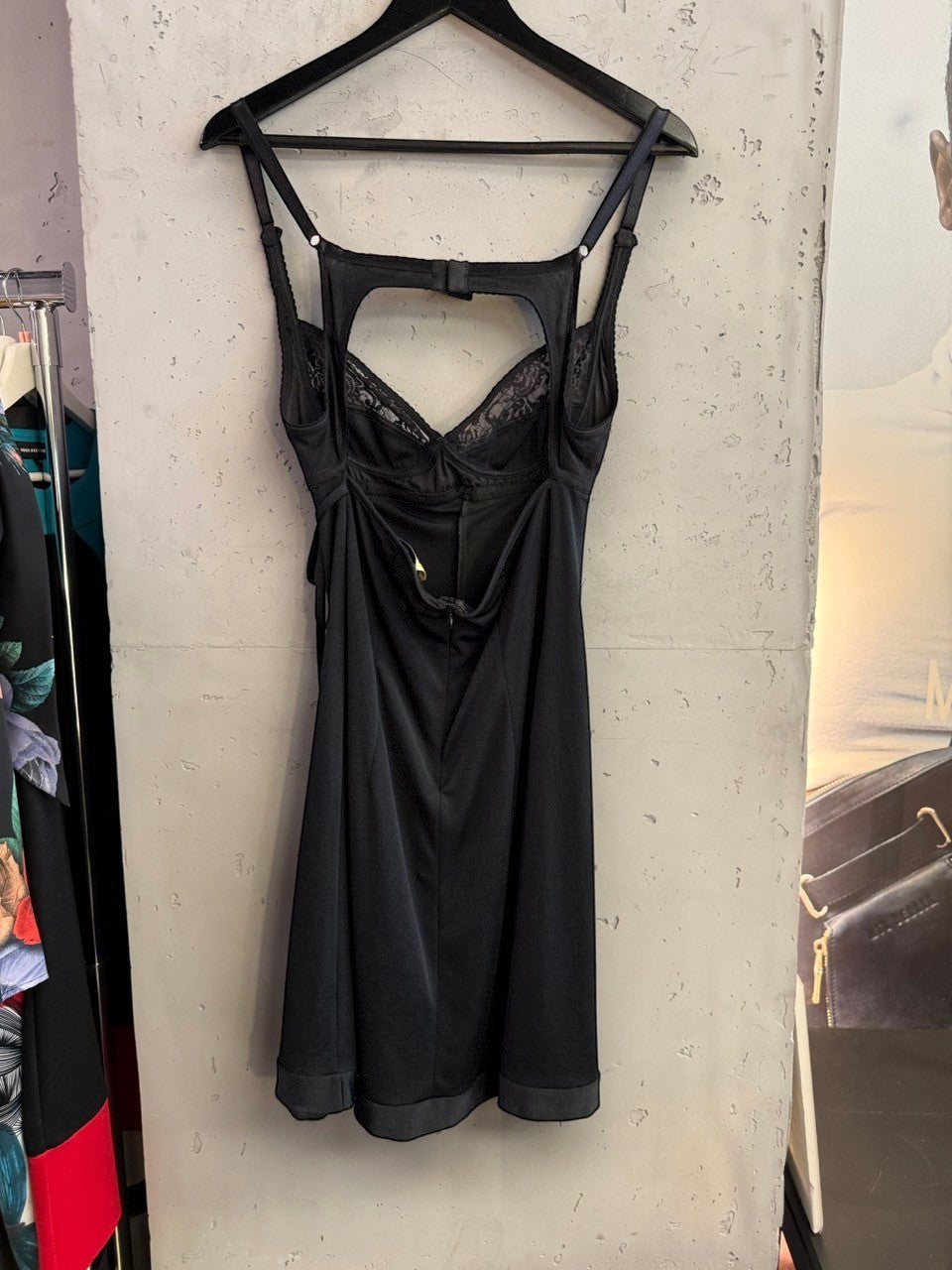 BERLIN VINTAGE CORNER black D&G Dolce & Gabbana mini dress with lace bodice and cut-out back detail on a hanger