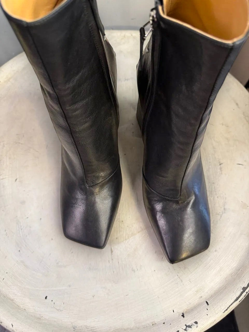 BERLIN VINTAGE CORNER black leather square toe heeled ankle boots with side zipper and tan heel detail.