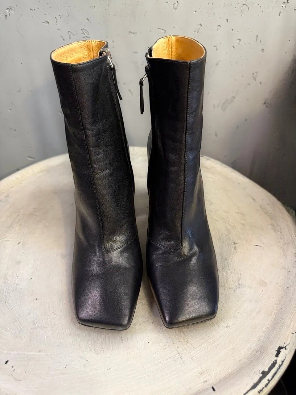 BERLIN VINTAGE CORNER black leather square toe heeled ankle boots with side zipper and tan heel detail.