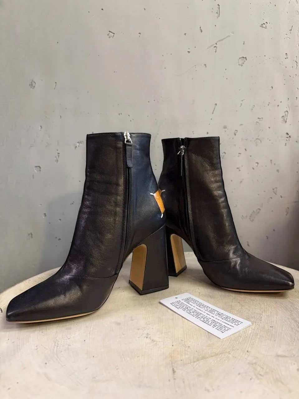 BERLIN VINTAGE CORNER black leather square toe heeled ankle boots with tan heel detail and side zipper.