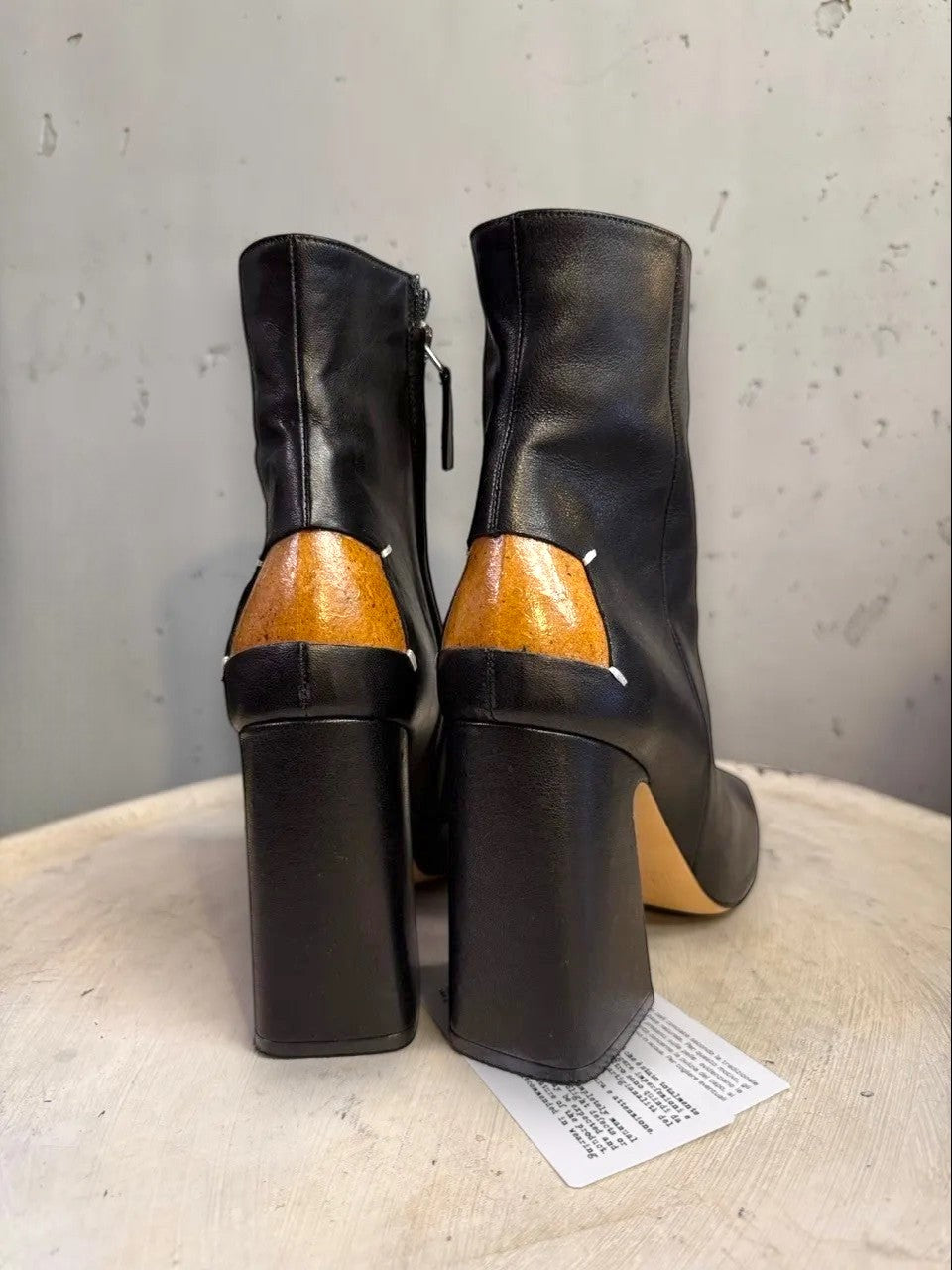 BERLIN VINTAGE CORNER black leather square toe heeled ankle boots with tan heel detail and side zipper.