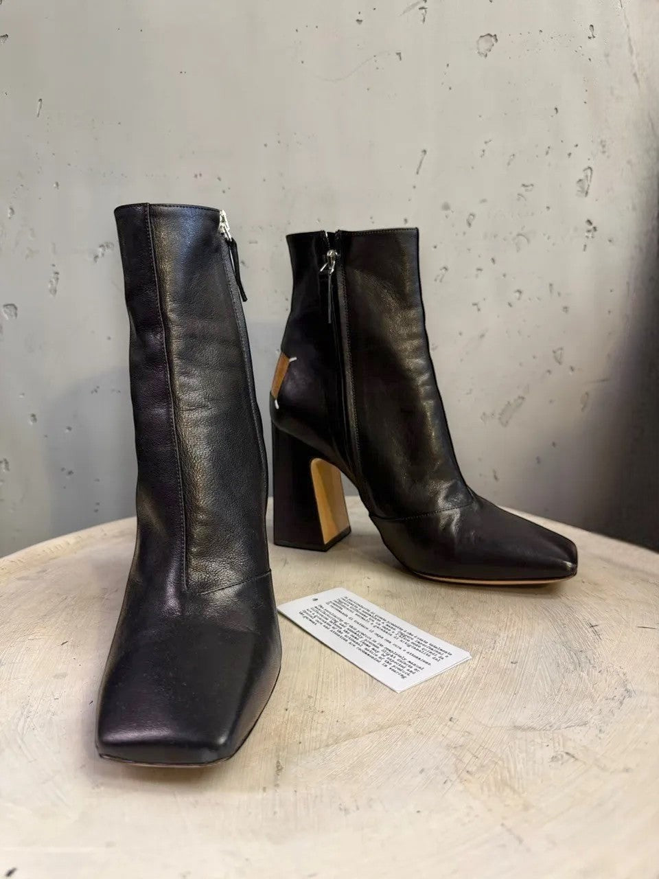 BERLIN VINTAGE CORNER black leather square toe heeled ankle boots with side zipper and tan heel detail.