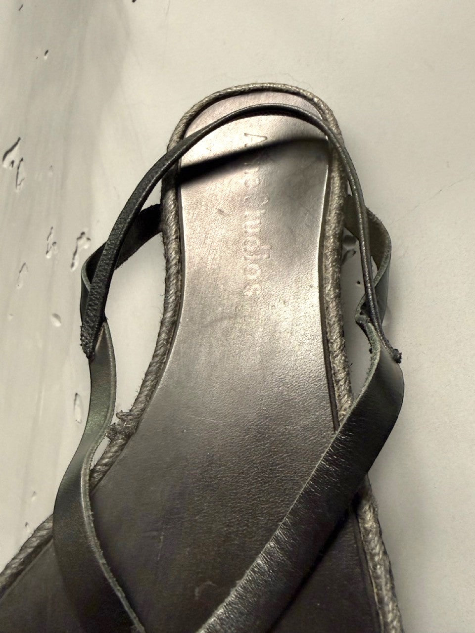 BERLIN VINTAGE CORNER black leather strappy flat sandals with jute-wrapped midsole and minimalist design.