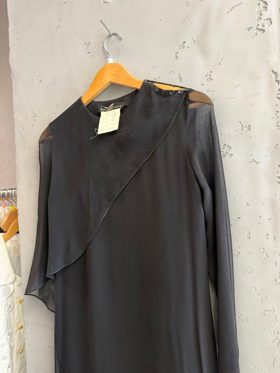 BERLIN VINTAGE CORNER black midi dress with sheer sleeves and asymmetrical neckline, featuring button details.