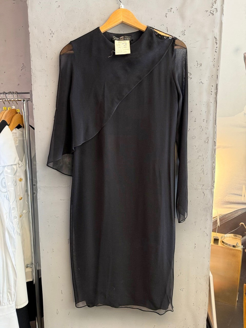 BERLIN VINTAGE CORNER black midi dress with sheer sleeves, asymmetrical neckline, and button details.