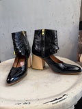 BERLIN VINTAGE CORNER black patent leather ankle boots with wooden block heel, pointed toe, ankle strap, and side zipper.
