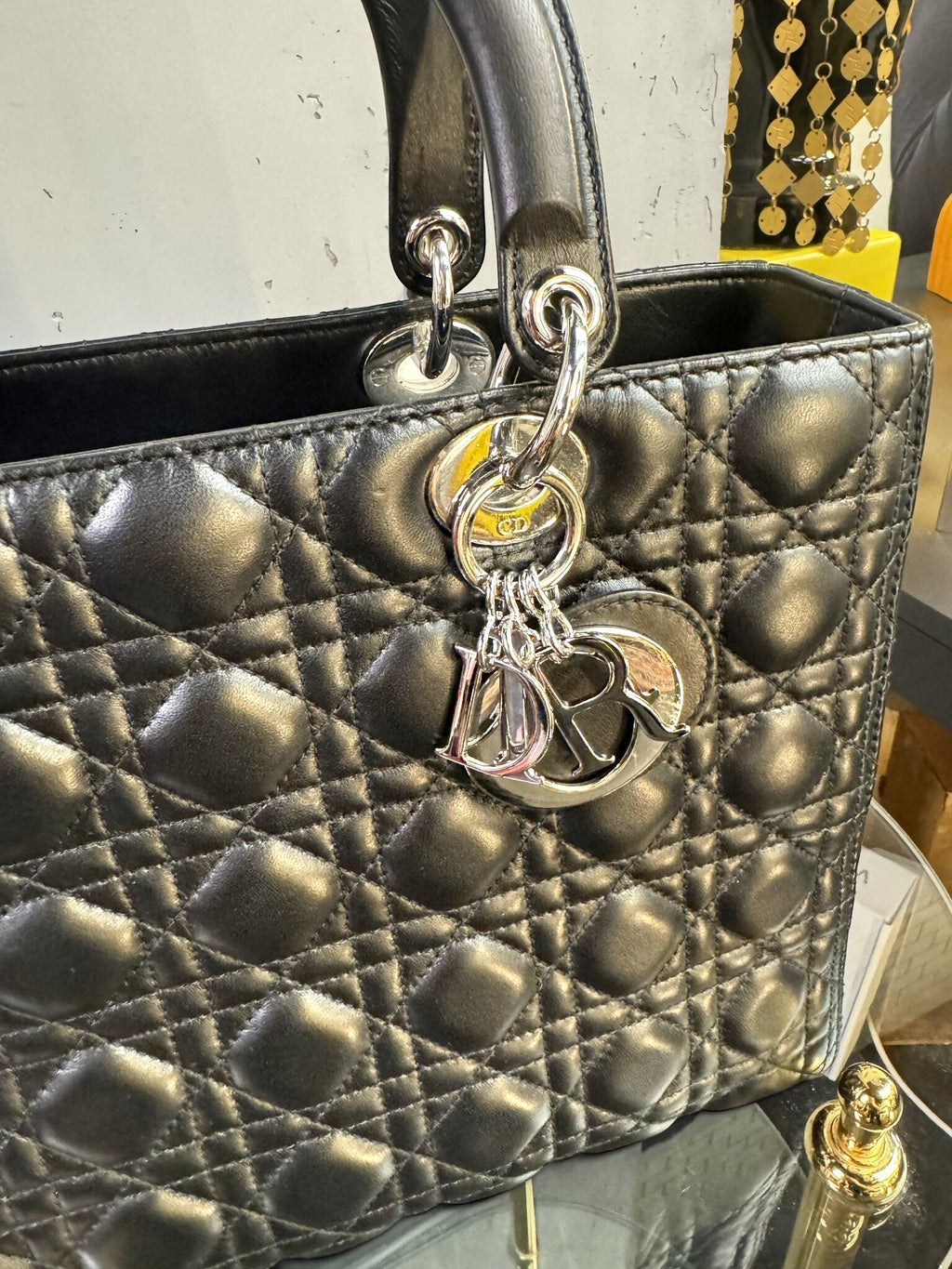 BERLIN VINTAGE CORNER black quilted leather handbag with signature cannage stitching and silver-tone logo charms.