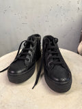 BERLIN VINTAGE CORNER black quilted high-top platform sneakers with lace-up front and side zipper detail.