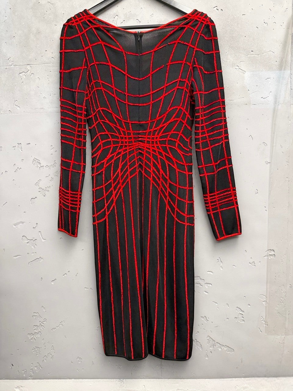 BERLIN VINTAGE CORNER black and red long-sleeved knit midi dress with a geometric grid pattern and V-neckline.