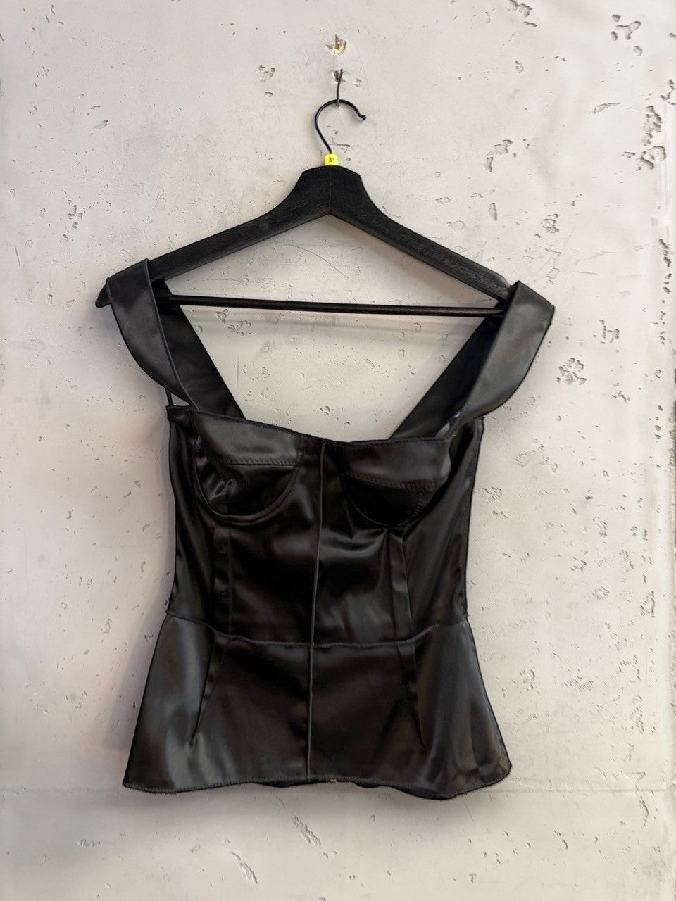 BERLIN VINTAGE CORNER black satin corset tank top with structured molded cups and wide straps on a hanger