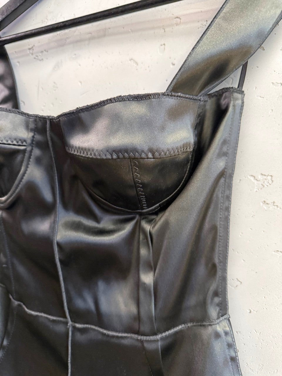 BERLIN VINTAGE CORNER black satin corset tank top with structured molded cups and detailed seam stitching.