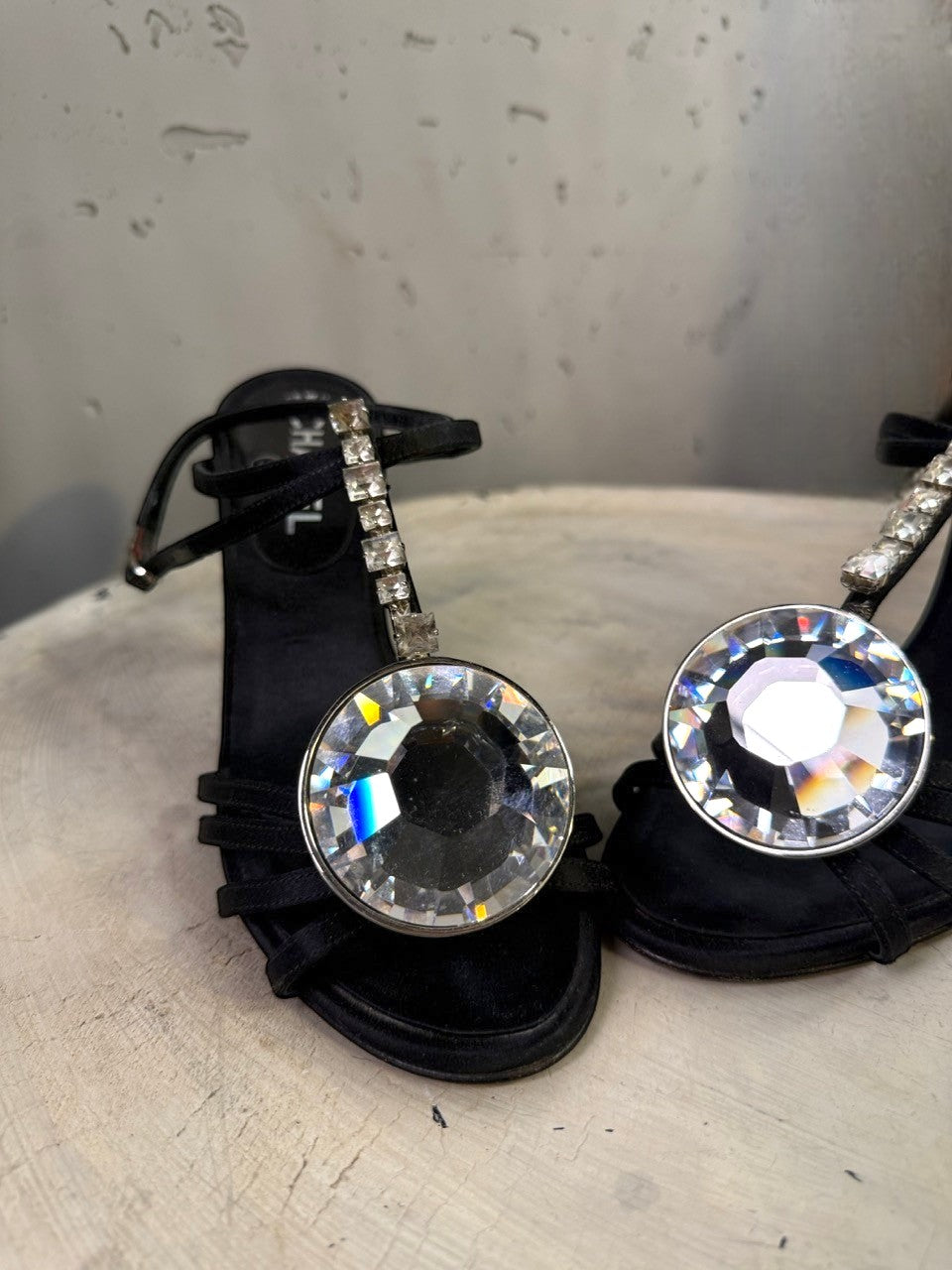BERLIN VINTAGE CORNER black satin heeled sandals with crisscross straps and large crystal embellishments.