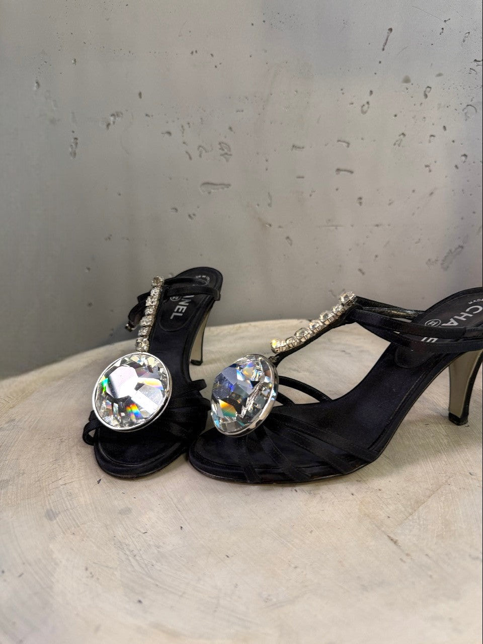 BERLIN VINTAGE CORNER black satin heeled sandals with crisscross straps and large crystal embellishments on the T-strap.