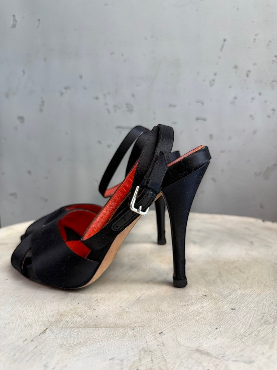 BERLIN VINTAGE CORNER black satin strappy high heel sandals with red leather lining and buckle closure.