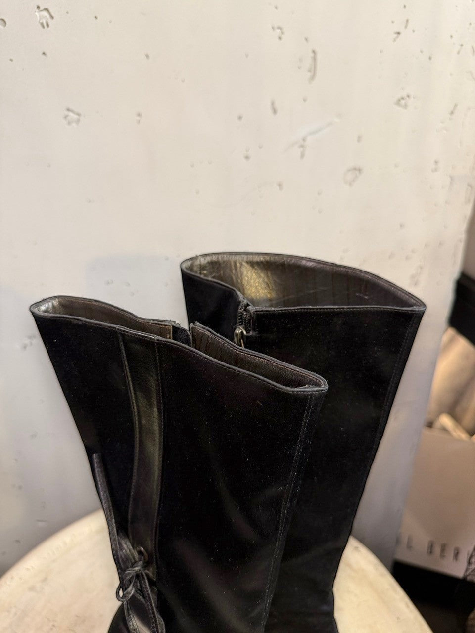 BERLIN VINTAGE CORNER black suede and leather knee-high boots with pointed toe, stiletto heel, side zip, and lace-up back detail.