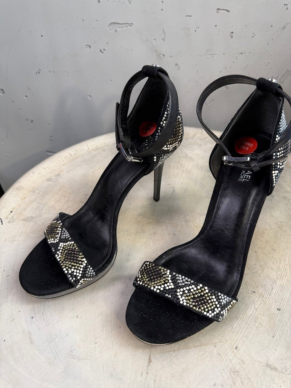 BERLIN VINTAGE CORNER black suede stiletto heels with rhinestone embellished snake-print ankle strap and open toe.